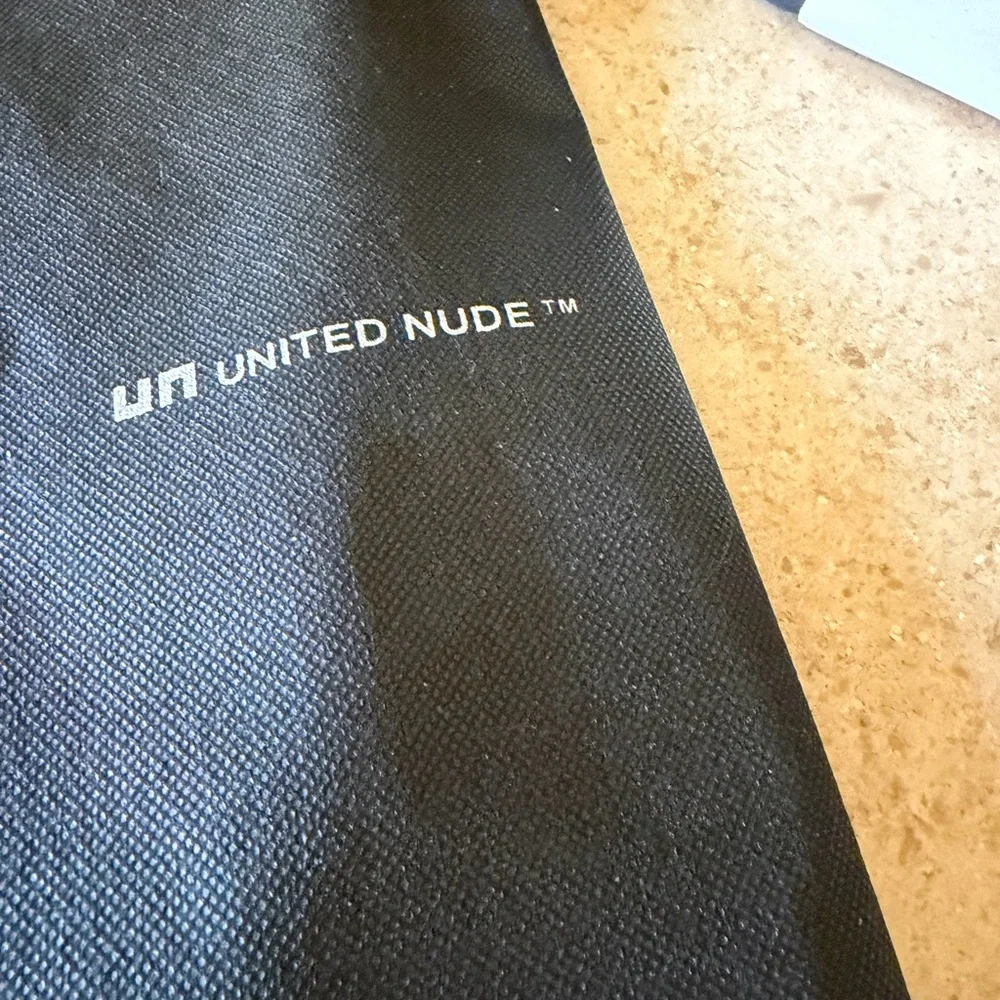 Very cool United Nude size 39 black and white platform shoes.
